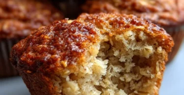 Image of fresh banana oat muffins on a plate, ideal for a healthy breakfast.