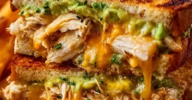 Delicious Chicken Avocado Melt Sandwich with melted cheese and fresh ingredients
