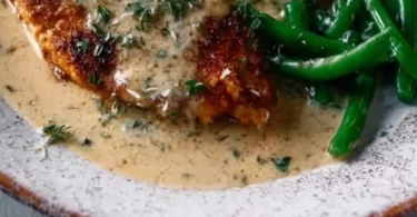 Delicious Chicken Schnitzel served with a creamy sauce