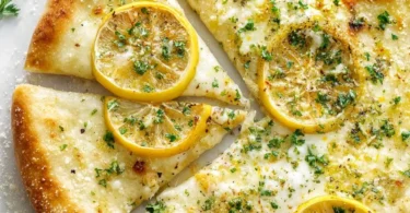 Lemon Pizza topped with fresh herbs and citrus zest for a refreshing flavor
