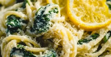Lemon ricotta pasta with fresh spinach served in a bowl