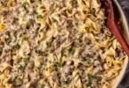 Creamy ground beef stroganoff served with noodles in a bowl