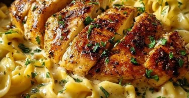 Delicious chicken dish served with buttered noodles