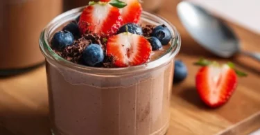 Delicious Chocolate Protein Pudding in a bowl topped with chocolate shavings