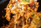 Crockpot Chicken Enchiladas Casserole served in a bowl with toppings