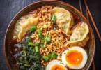 Delicious dumpling ramen bowl with rich broth and fresh toppings