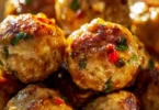 Delicious Thai baked chicken meatballs on a plate with fresh herbs