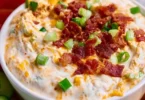 High Protein Crack Dip served in a bowl with fresh vegetables for dipping