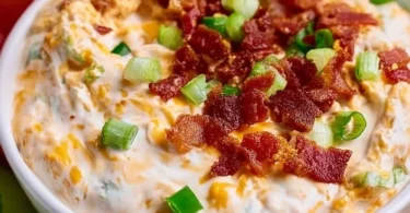 High Protein Crack Dip served in a bowl with fresh vegetables for dipping