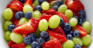 Honey Lime Fruit Salad with a colorful mix of fresh fruits coated in honey lime dressing