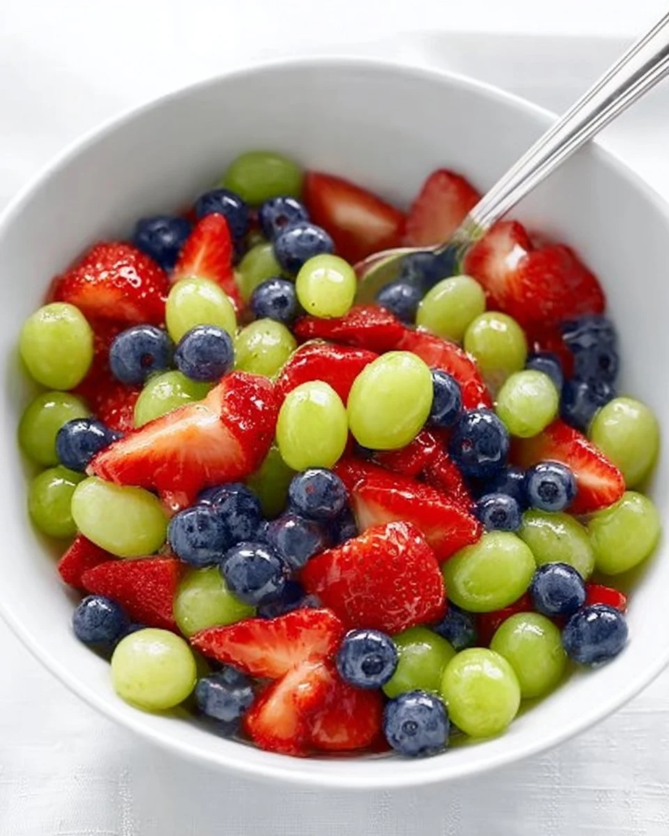 Honey Lime Fruit Salad with a colorful mix of fresh fruits coated in honey lime dressing