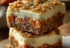 Delicious carrot cake cream cheese bars topped with creamy frosting