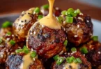 Korean BBQ Meatballs served with spicy mayo dip on a plate