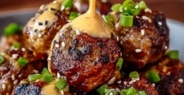 Korean BBQ Meatballs served with spicy mayo dip on a plate