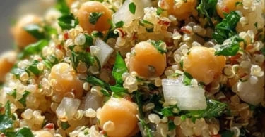 Lemon Herb Quinoa with Chickpeas served in a bowl garnished with herbs