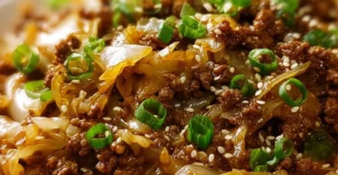 Low-carb Mongolian Ground Beef and Cabbage dish served in a bowl.