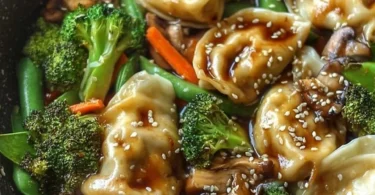 Delicious quick potsticker stir fry with colorful vegetables in a pan.