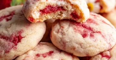 Strawberry cheesecake cookies with cream cheese frosting and fresh strawberries