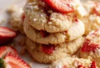 Freshly baked Strawberry Shortcake Cookies with strawberries and cream